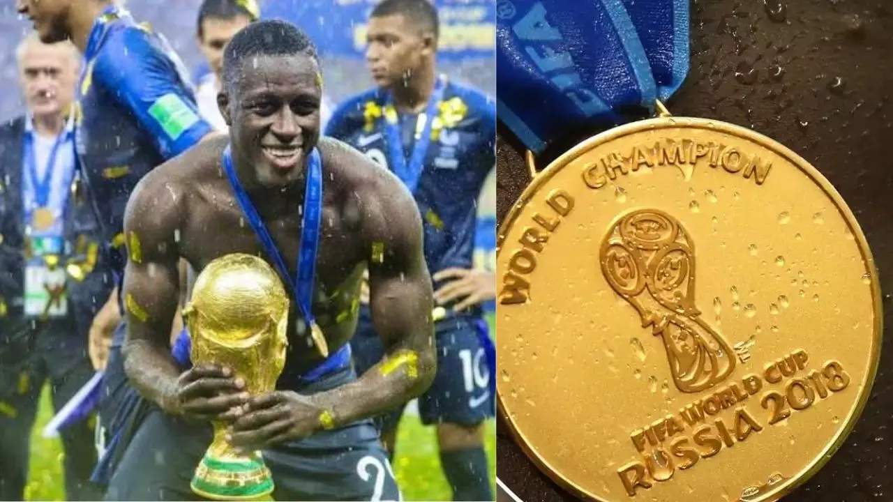 Benjamin Mendy: आर्थिक तंगी के बीच इस फुटबॉलर ने बेच डाला FIFA World Cup का मेडल, इतने में लगी बोली Benjamin Mendy: आर्थिक तंगी के बीच इस फुटबॉलर ने बेच डाला FIFA World Cup का मेडल, इतने में लगी बोली