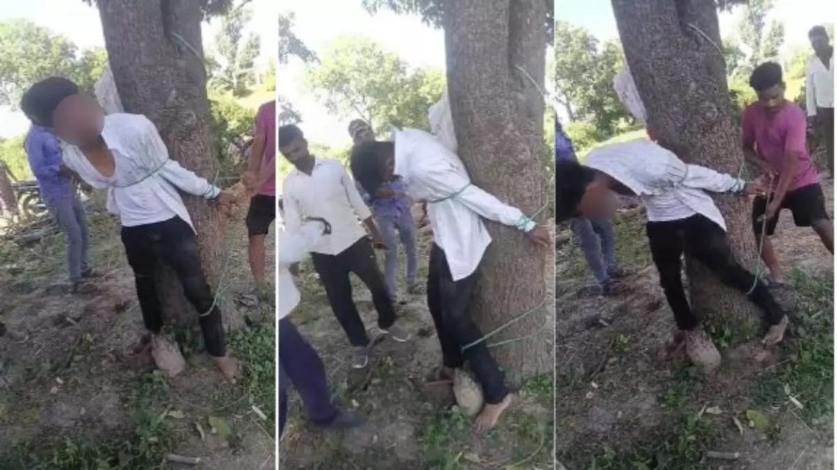 MP News : नाबालिग से छेड़छाड़ के बाद ग्रामीणों ने अतिथि शिक्षक की पेड़ से बांधकर की पिटाई, VIDEO वायरल MP News : नाबालिग से छेड़छाड़ के बाद ग्रामीणों ने अतिथि शिक्षक की पेड़ से बांधकर की पिटाई, VIDEO वायरल
